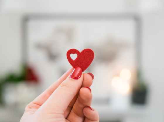 Holding a heart in hand